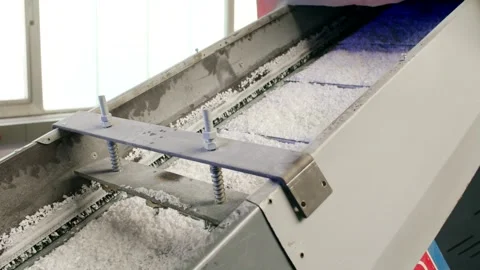 Vibrating Feeder Trough Sorting Plastic Flakes, Recycling Plant, Close Up Shot Stock Footage 341299213