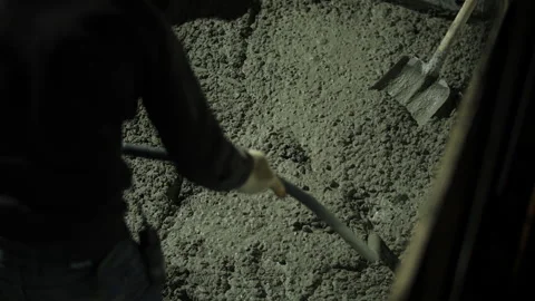 Vibrating fresh concrete during compaction at construction site Stock Footage 323433332