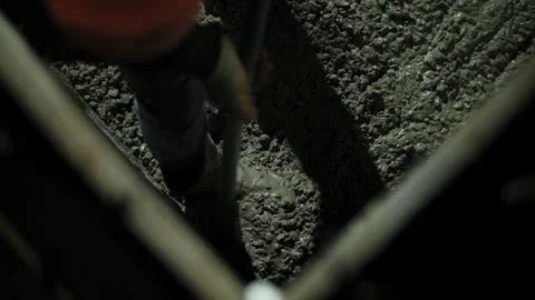 Vibrating fresh concrete during compaction inside formwork Stock Footage 323444892