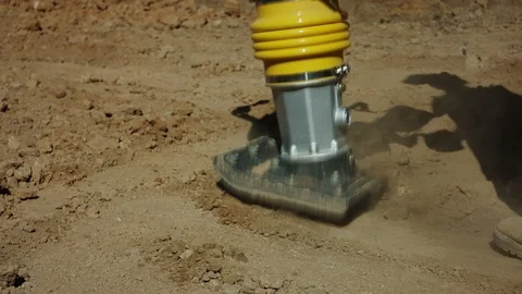 Vibrating Machine Is Compacting Soil Stock Footage 116383469