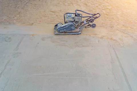 Vibrating machine for laying paving slabs Stock Photos