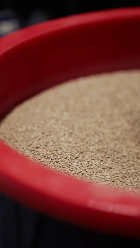 Vibrating polishing drum grinds precisely details by hard particles in workshop Stock Footage 346611873