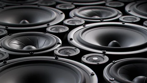 "Vibrating speaker membranes stacked in endless loop. Lit by studio lights. 4K Stock Footage 94590758