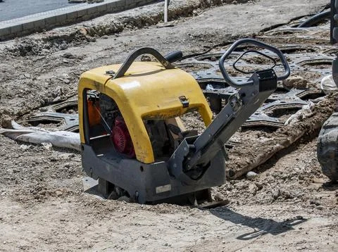 Vibratory Plate Compactor on Prepared Construction Ground Fotos Stock