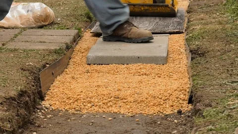 Vibratory Plate Compactor Stone Path Stock Footage 89298317