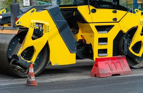 Vibratory road roller. Close-up of the work of road machinery Stock Photos