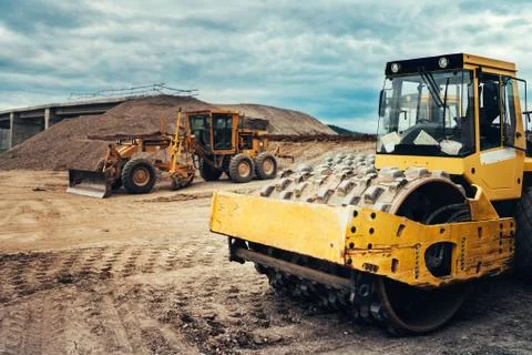 Vibratory roller, Soil compactor, Bulldozer and other industrial machinery Stock Photos
