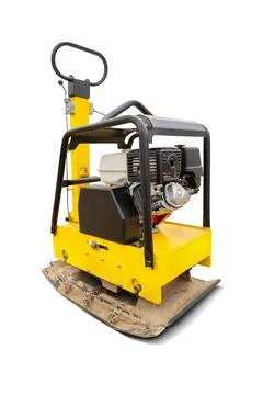 The vibratory soil compaction plate is equipped with a reliable engine and a  Stock Photos