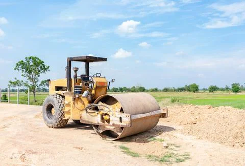 Vibratory soil compactor working on  construction site. Stock-Fotos