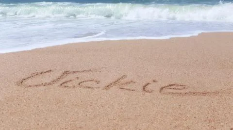 Vickie. Name in the sand Stock Photos