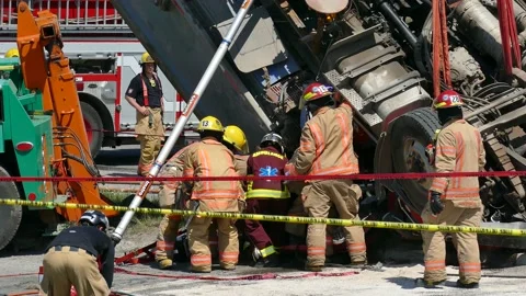 Victim being put on stretcher after truck rollover Stock Footage 133269061