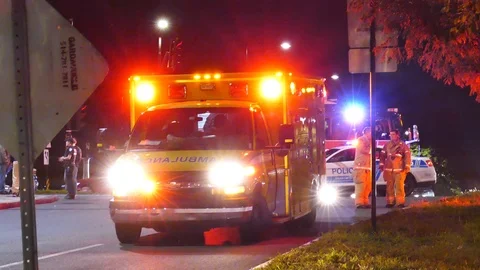 Victim inside ambulance at car vs ped incident Stock Footage 119902169