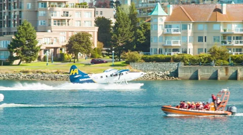 Victoria BC Inner Harbour Action with Seaplane Landing Among Boats Stock Footage 61007953