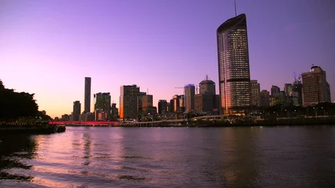 Victoria Bridge over the Brisbane River in Australia with a pink lights at night Stock Footage
