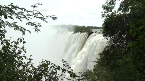 Victoria Falls framed with trees Video stock 22870928