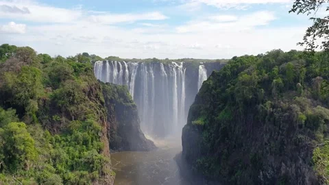 Victoria Falls, the largest Waterfall with a dramatic Sky, Zambia, Stock Footage 132577321