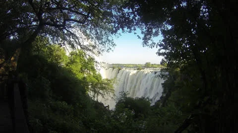 Victoria Falls through a window of trees Stock Footage 22881363