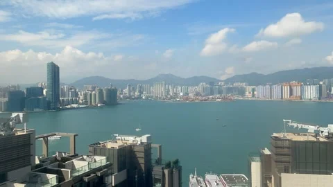 Victoria Harbour timelapse with drifting clouds and marine traffic in Hong Kong Stock Footage 319530898