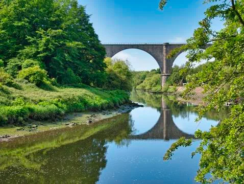 Victoria Viaduct casting a reflection in the River Wear, near Washington, UK Stock Photos