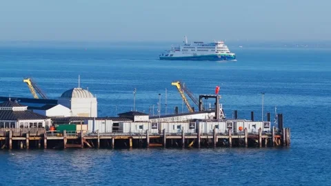 Victoria of Wight ferry passing Ryde Pier on summer morning Stock Footage 336240385