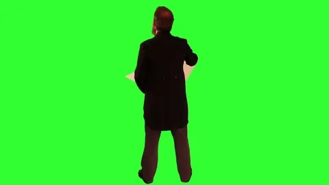 Victorian man standing and looking at plans back view no hat greenscreen Stock Footage 79852207