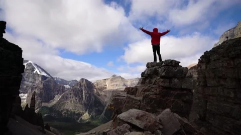 Victorious Man On Epic Mountain Peak Stock Footage 229055480