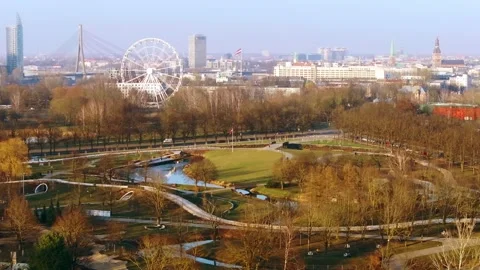 Victory Park Awakens in Spring – Fast Drone Pan Across Riga Skyline Stock Footage 310762263