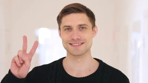 Victory Sign by Middle Aged Man Sitting in Office Stock Footage