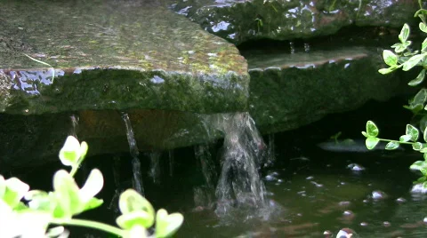 Vid005 trickling water over rocks Stock Footage