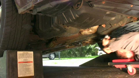 Vid026 working on car rolling in 스톡 동영상 486891