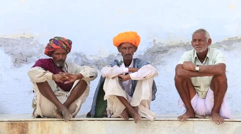 Video 1920x1080  Indian three men, sits along the sacred lake. Pushkar, India Stock Footage 45921599