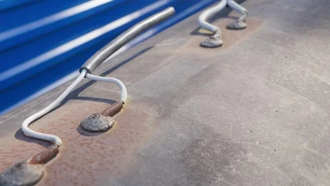 Video 4k. Close-up of weathered electrical wires bolted down to a rusty metal Stock Footage 278805396