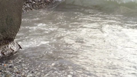 Video 4k with waves that beat on the rocks. Breakwater during a storm. Very Video stock 161776709