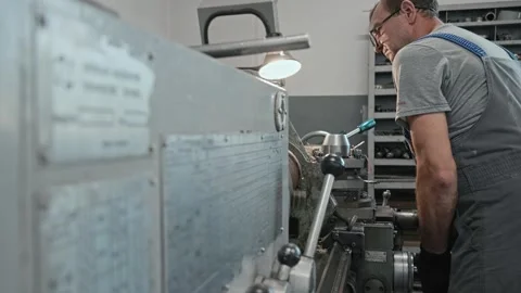 Video 4k. Worker operates lathe machine for metal tube inner finish, utiliz.. Stock Footage 279090537