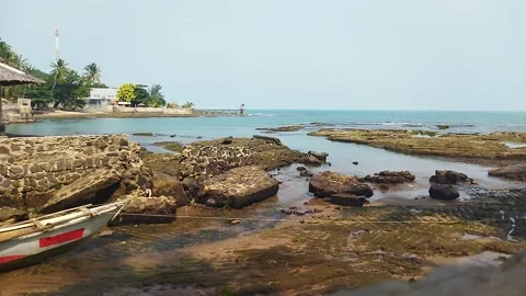 Video about beach scenery with waves and rocks	 Stock Footage 296979650