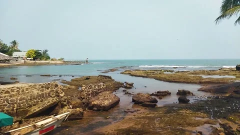 Video about beach scenery with waves and rocks	 Stock Footage 296979657