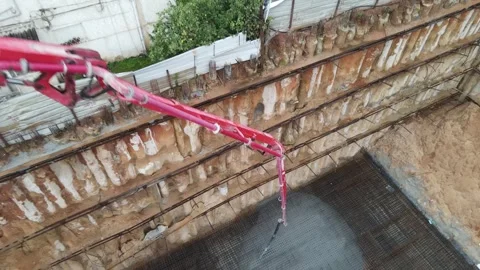 Video about a construction site crane pouring concrete Stock Footage 281687006