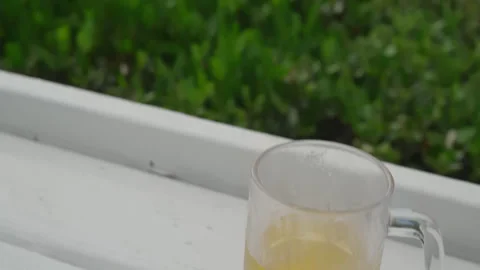 Video about a hamburger and a beer on the view of the city of Miami Stock Footage 282917096