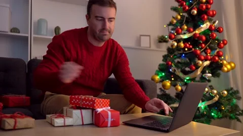 Video about happy man checking online christmas wish list ideas Stock Footage