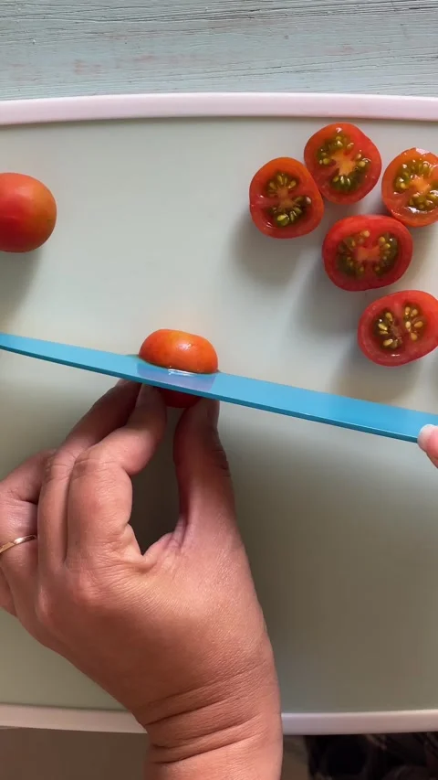 Video from above cutting cherry tomatoes. Stock Footage 287860232