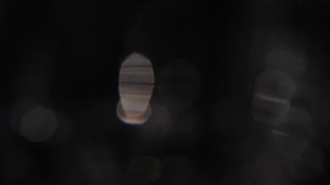 Video of abstract white and rainbow bokeh light moving in slow motion 動画素材 317454407