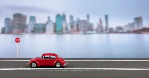 Video of an accident between two car figurines, before a stop sign on the hig Stock Footage 133498469