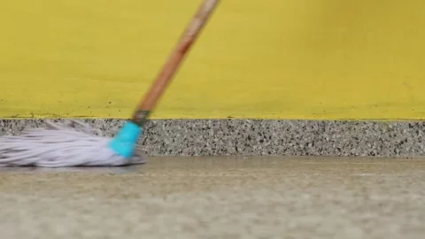 Video of activity of mopping ceramic floor using white mop Stock Footage 304637147