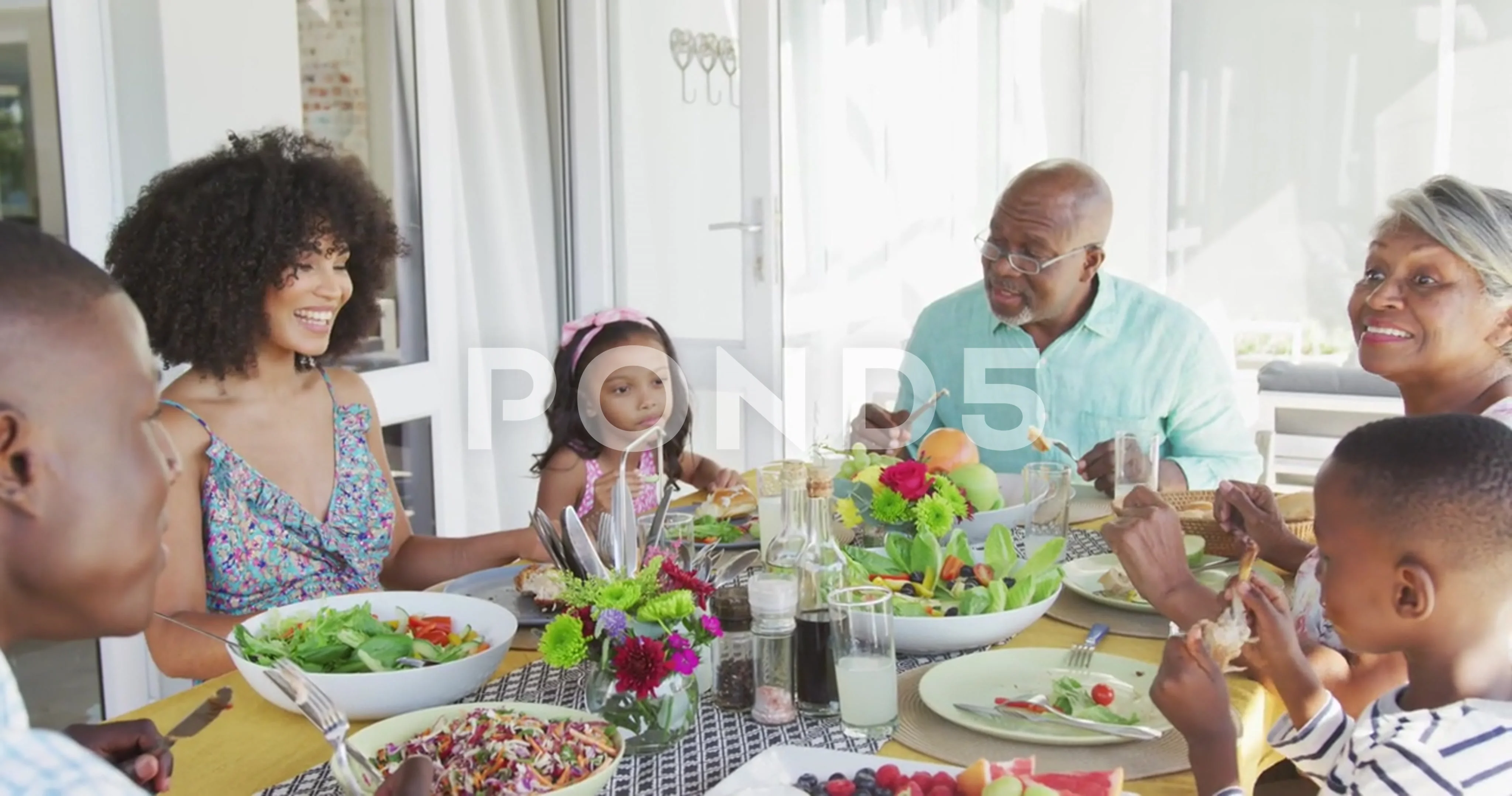 Video of african american family spending time together and having dinner