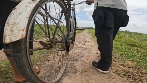 Video angle from below, the spokes of a rotating bicycle wheel Stock Footage 222673578