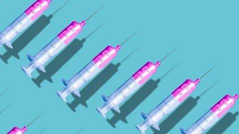 Video Animation Creative pattern made with a syringe on blue background. Stock Footage