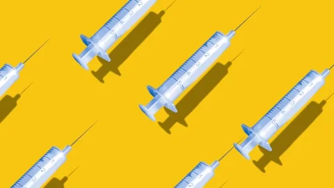 Video Animation Creative pattern made with a vaccine syringe Loop Animation Video stock 145990789