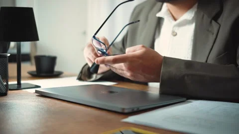 Video of an anonymous architect cleaning his glasses and starting his workday wi Stock Footage 346329600