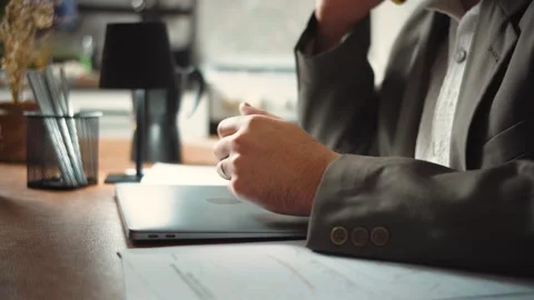 Video of an anonymous businessman answering a client’s phone call and explaining Stock Footage 346329853