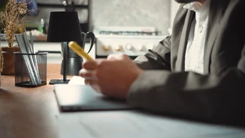 Video of an anonymous businessman using his smartphone at home with financial ch Stock Footage 346329598